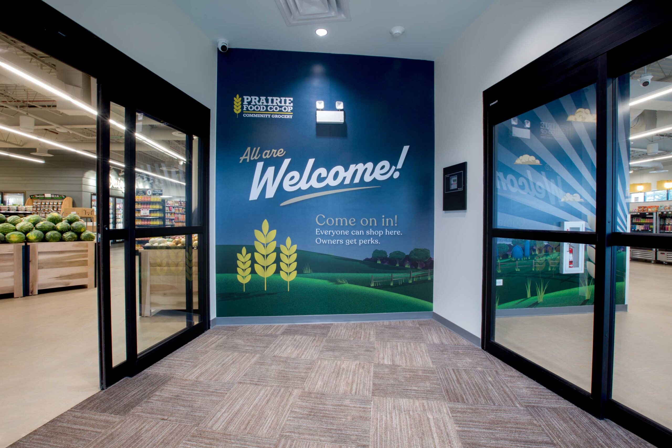 Prairie Food Co-Op interior – foyer with Welcome sign.